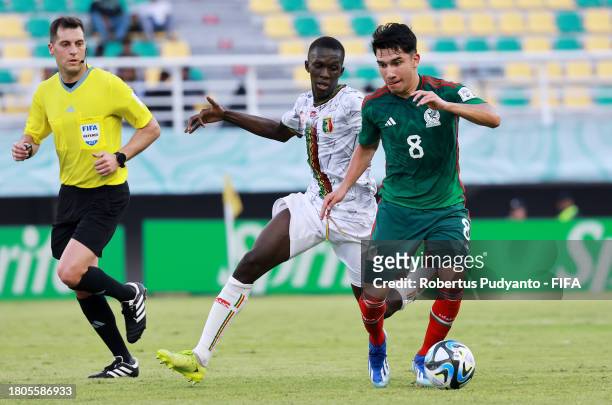 Jose Urias of Mexico battles for possession with Ousmane Thiero of Mali during the FIFA U-17 World Cup Round of 16 match between Mali and Mexico at...