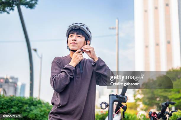 young man riding electric scooter in the city - bright future stock pictures, royalty-free photos & images