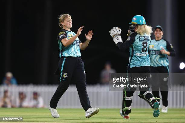 Georgia Voll of the Heat celebrates dismissing Ellyse Perry of the Sixers during the WBBL match between Brisbane Heat and Sydney Sixers at Allan...
