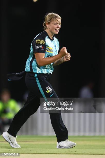 Georgia Voll of the Heat celebrates dismissing Ellyse Perry of the Sixers during the WBBL match between Brisbane Heat and Sydney Sixers at Allan...