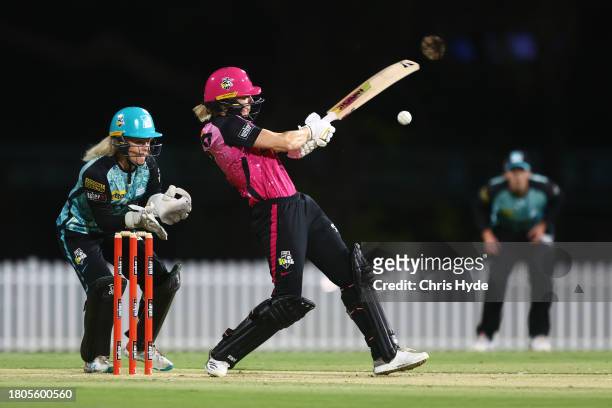 Ellyse Perry of the Sixers bats during the WBBL match between Brisbane Heat and Sydney Sixers at Allan Border Field, on November 21 in Brisbane,...