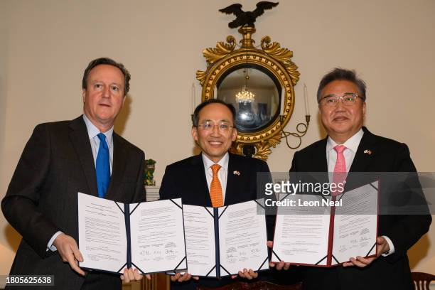 British Foreign Secretary David Cameron, South Korea's Deputy Prime Minister Choo Kyung-ho and South Korean Foreign Minister Park Jin pose for...