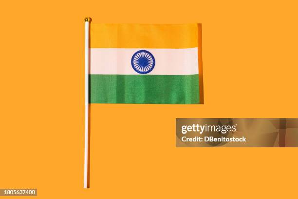 flag of the republic of india on orange background. independence day concept, 15 august, republic day of india, celebration, orange, green, white and patriotism. - january icon stock pictures, royalty-free photos & images