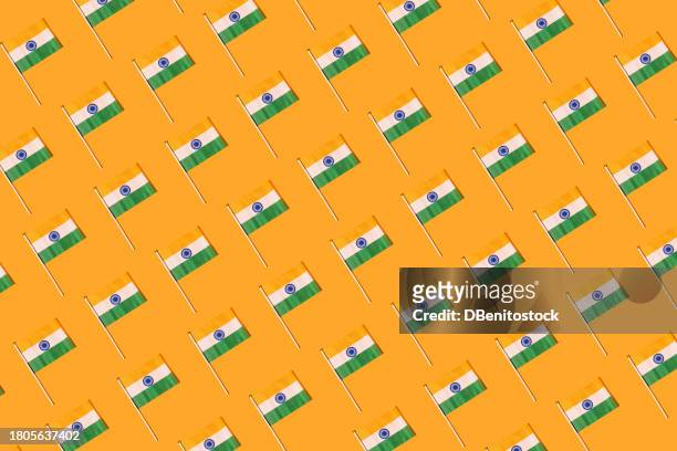pattern of flags of the republic of india on orange background. independence day concept, 15 august, republic day of india, celebration, orange, green, white and patriotism. - january icon stock pictures, royalty-free photos & images
