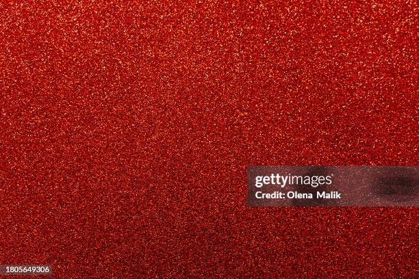 red glittering background. new year and christmas celebration concept. - paillette-mercerie photos et images de collection