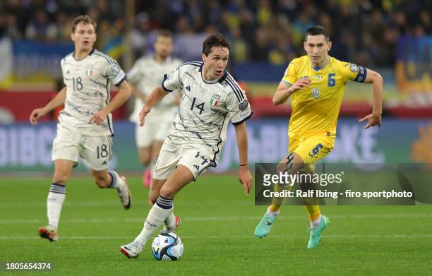 Federico Chiesa of Italy and Taras Stepanenko of Ukraine compete for the ball during the UEFA EURO 2024 European qualifier match between Ukraine and...