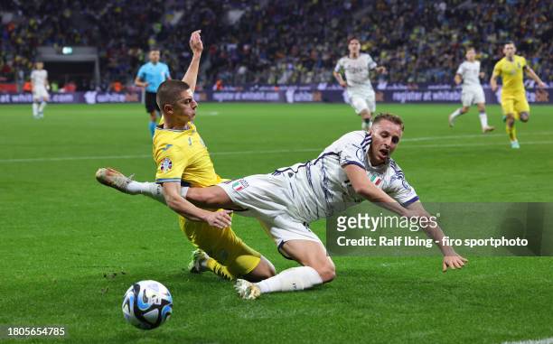 Vitaliy Mykolenko of Ukraine and Davide Frattesi of Italy compete for the ball during the UEFA EURO 2024 European qualifier match between Ukraine and...