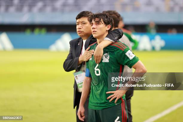 Isaac Martinez of Mexico looks dejected following the team's defeat in the FIFA U-17 World Cup Round of 16 match between Mali and Mexico at Gelora...