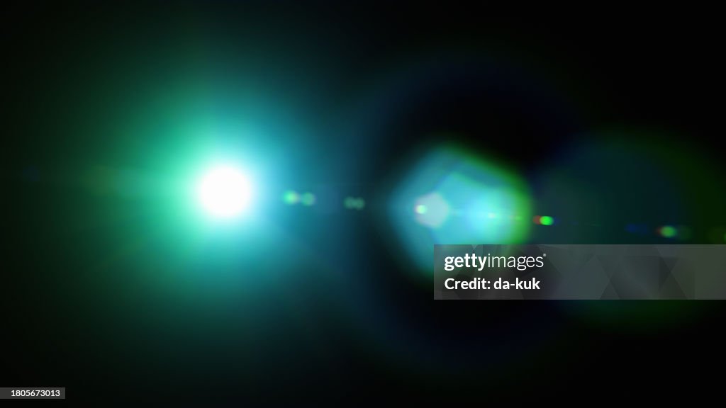 Green futuristic lens flare overlay on black background design element