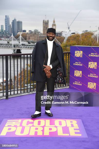 Blitz Bazawule attends a photocall for "The Color Purple" at The IET Building Rooftop on November 21, 2023 in London, England.