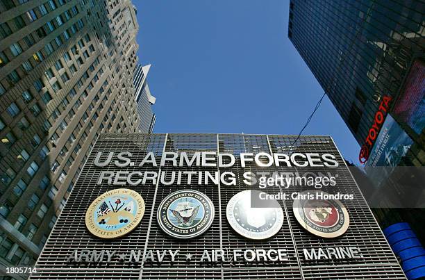 The U.S. Armed Forces Recruiting Station in Times Square sits nestled among skycrapers February 20, 2003 in New York City. "The Booth," as it is...