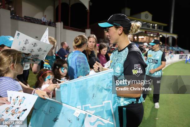 Nicola Hancock with Heat fans during the WBBL match between Brisbane Heat and Sydney Sixers at Allan Border Field, on November 21 in Brisbane,...