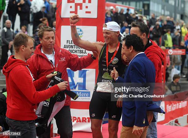 Bart Colpaert of Belgium celebrates winning the men's race during the Challenge Triathlon Almere-Amsterdam on September 14, 2013 in Almere,...