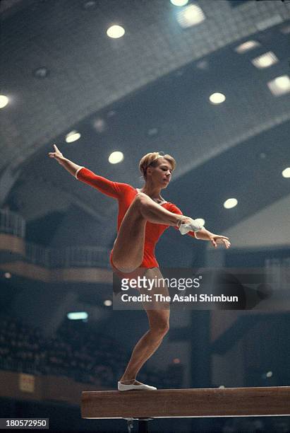 Larysa Latynina of Soviet Union competes in the Balance Beam of the Women's Artistic Gymnastics Individual All-Around during the Tokyo Olympics at...