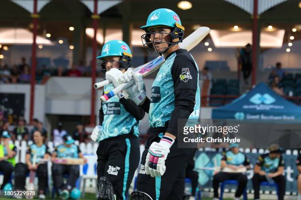 Grace Harris and Georgia Redmayne of the Heat walkout during the WBBL match between Brisbane Heat and Sydney Sixers at Allan Border Field, on...