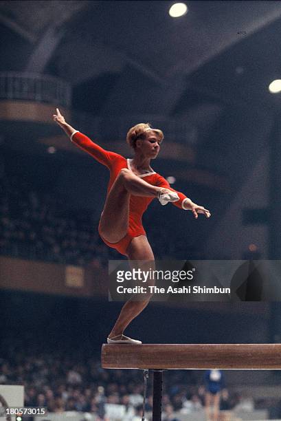 Larysa Latynina of Soviet Union competes in the Balance Beam of the Women's Artistic Gymnastics Individual All-Around during the Tokyo Olympics at...