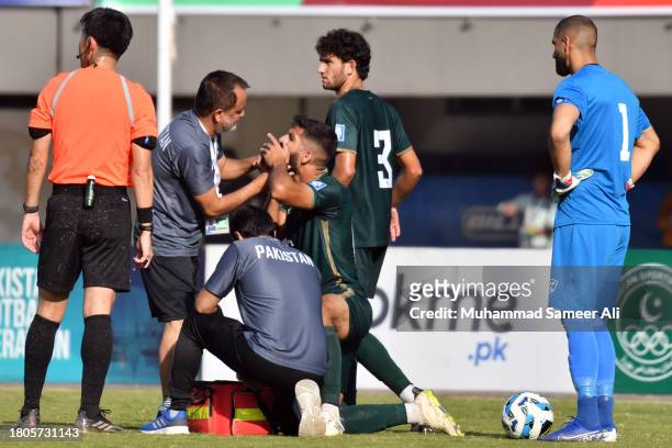 Doctors check Mamoon Moosa Khan during the 2026 FIFA World Cup AFC Qualifier Group G match between Pakistan and Tajikistan at Jinnah Sports Stadium...