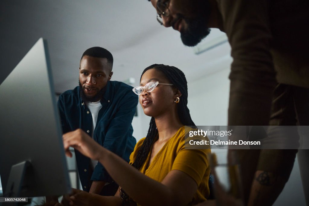 Determined Entrepreneurs Collaborating on a Late-Night Project