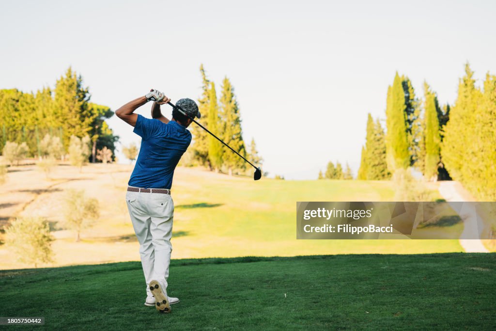 Professional golf player on the golf course