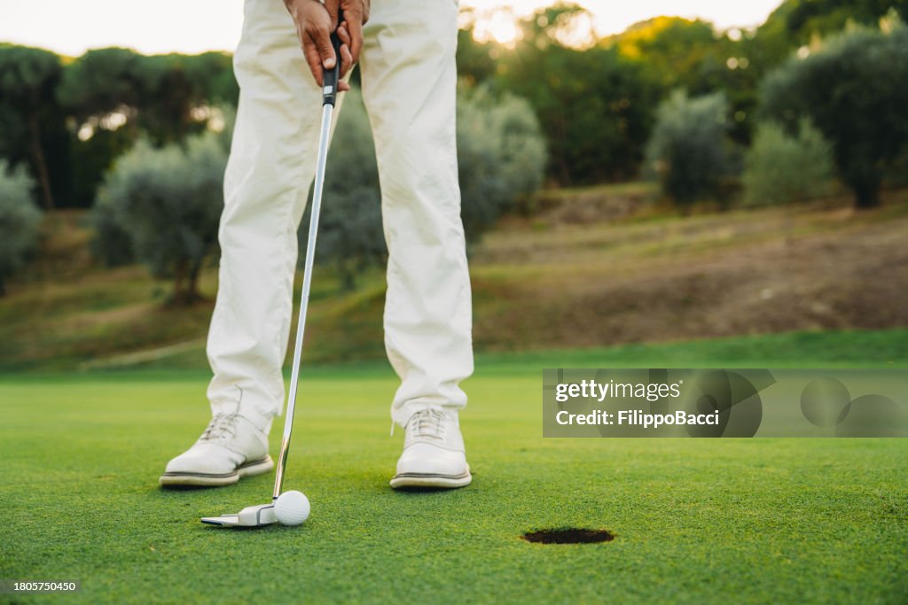 Closing putt on the green