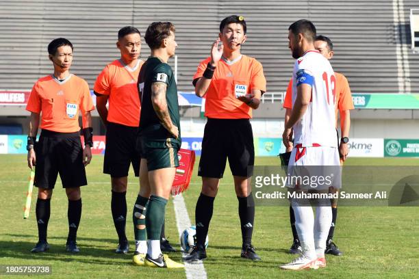 The coin toss between both teams at the start of the 2026 FIFA World Cup AFC Qualifier Group G match between Pakistan and Tajikistan at Jinnah Sports...