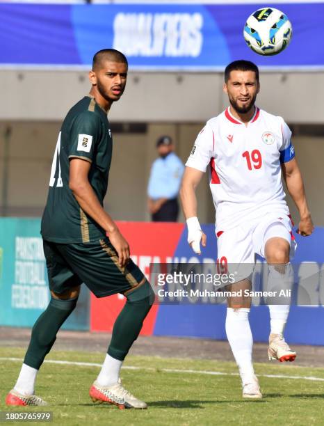 Akhtam Nazarov from Tajikistan and Harun Ar-Rashid Faheem from Pakistan during the 2026 FIFA World Cup AFC Qualifier Group G match between Pakistan...