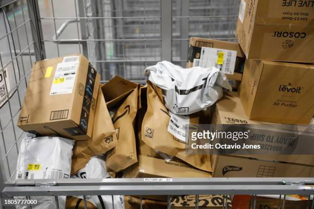Products are seen on at an Amazon fulfillment center where they are ready to ship out as same day orders during Cyber Monday at the Same-Day Delivery...