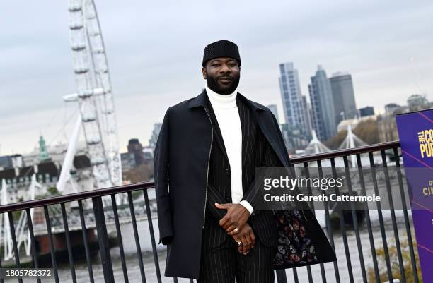 Blitz Bazawule attends "The Color Purple" Photocall at IET Building: Savoy Place on November 21, 2023 in London, England.