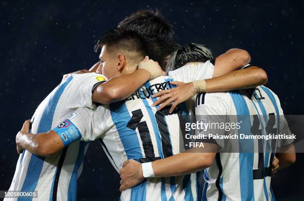 Claudio Echeverri of Argentina celebrates with teammates after scoring the team's third goal during the FIFA U-17 World Cup Round of 16 match between...