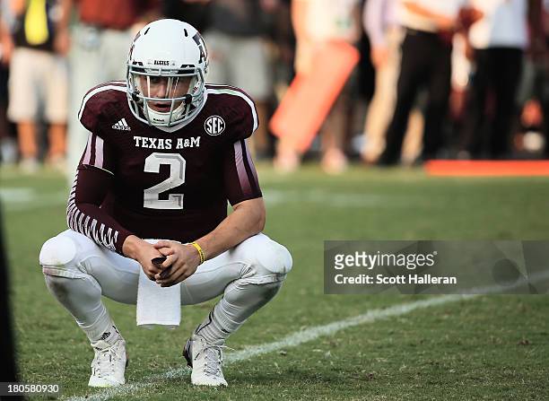 Johnny Manziel of Texas A&M Aggies reacts to a play in the fourth quarter during the game against the Alabama Crimson Tide at Kyle Field on September...