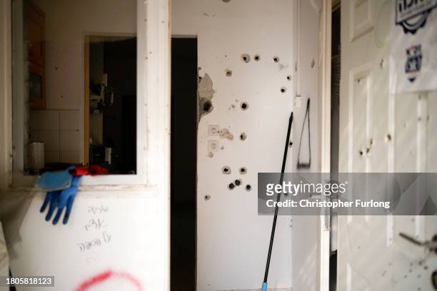 Bullet holes are seen after the October 7th Hamas attacks at Kibbutz Kfar Aza close the Gaza border as forensic analysis and investigation of the...