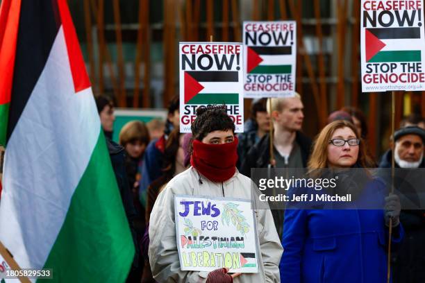Protestors gather during a demonstration outside the Scottish Parliament Building on November 21, 2023 in Edinburgh, Scotland. Demonstrators called...