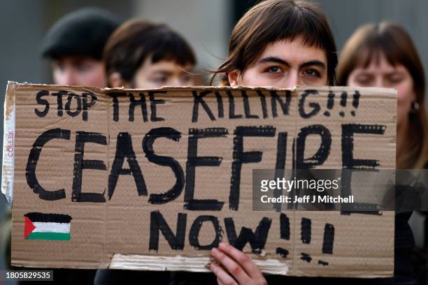 Protestors gather during a demonstration outside the Scottish Parliament Building on November 21, 2023 in Edinburgh, Scotland. Demonstrators called...