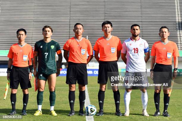 Match Officials with both team captains during the 2026 FIFA World Cup AFC Qualifier Group G match between Pakistan and Tajikistan at Jinnah Sports...