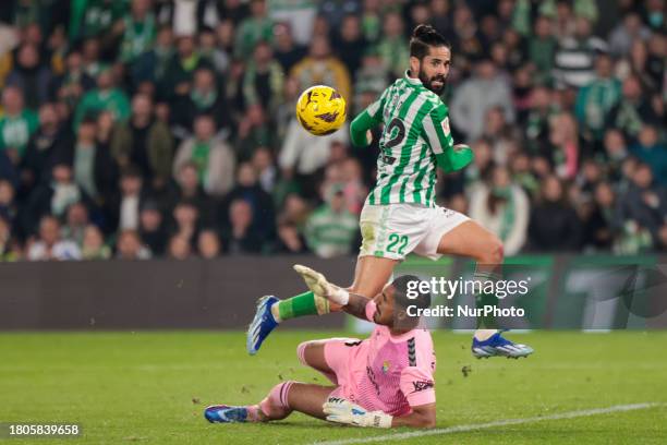 Francisco Roman Alarcon Suarez ''Isco'' of Real Betis is in action with Alvaro Valles of UD Las Palmas during the La Liga EA Sports match at Benito...