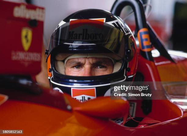 Gerhard Berger from Austria looks out from the cockpit of the Scuderia Ferrari Ferrari F1/87/88C Ferrari V6t during practice for the Formula One...