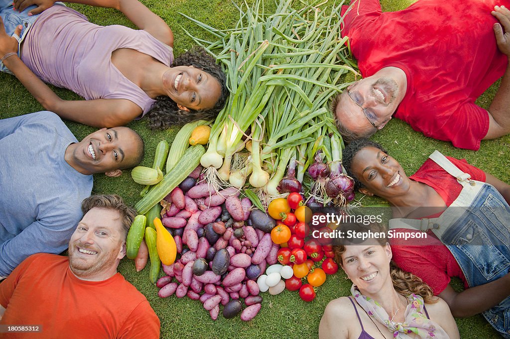 Friends pose with their summer harvest