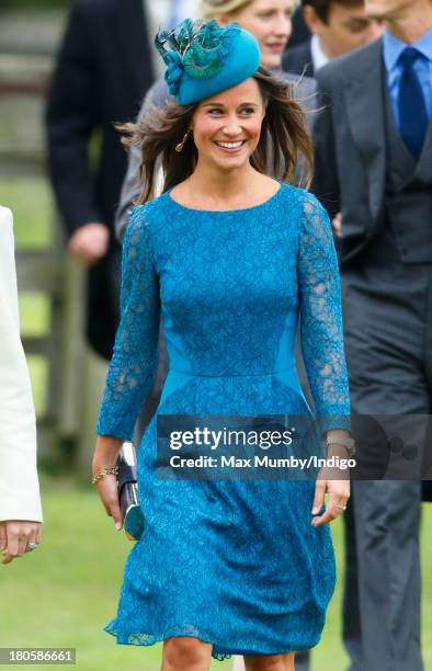 Pippa Middleton attends the wedding of James Meade and Lady Laura Marsham at the Parish Church of St. Nicholas in Gayton on September 14, 2013 near...