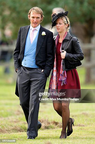 Mark Tomlinson and Laura Bechtolsheimer attend the wedding of James Meade and Lady Laura Marsham at the Parish Church of St. Nicholas in Gayton on...