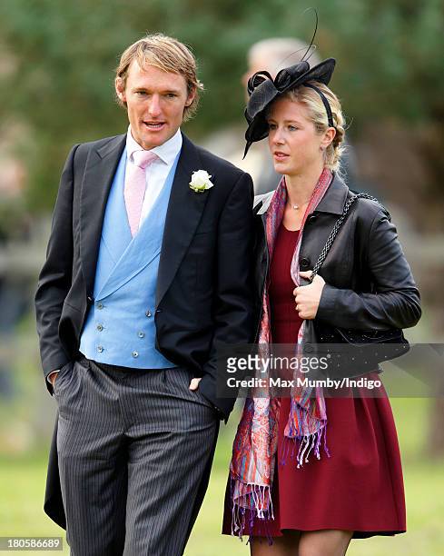 Mark Tomlinson and Laura Bechtolsheimer attend the wedding of James Meade and Lady Laura Marsham at the Parish Church of St. Nicholas in Gayton on...