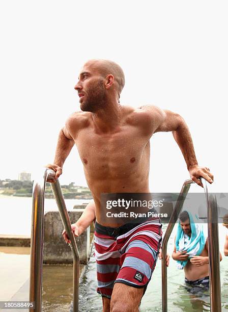 Jarrad McVeigh of the Swans swims during a recovery session at Coogee Beach on September 15, 2013 in Sydney, Australia.