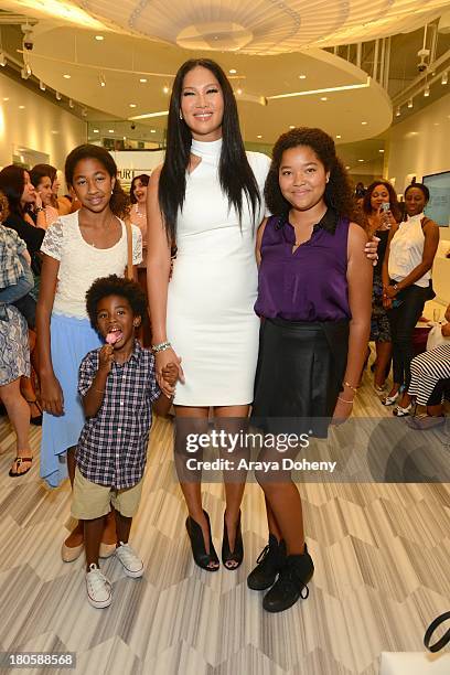 Ming Lee Simmons, Kenzo Lee Hounsou, Kimora Lee Simmons and Aoki Lee Simmons attend the JustFab Boutique grand opening with Kimora Lee Simmons at...