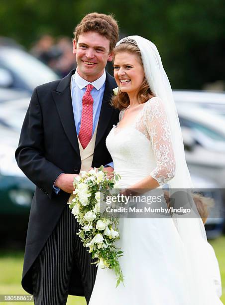 James Meade and Lady Laura Marsham leave the Parish Church of St. Nicholas in Gayton after their wedding on September 14, 2013 near King's Lynn,...