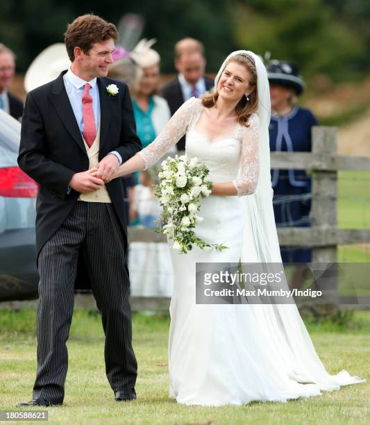 James Meade and Lady Laura Marsham leave the Parish Church of St. Nicholas in Gayton after their wedding on September 14, 2013 near King's Lynn,...