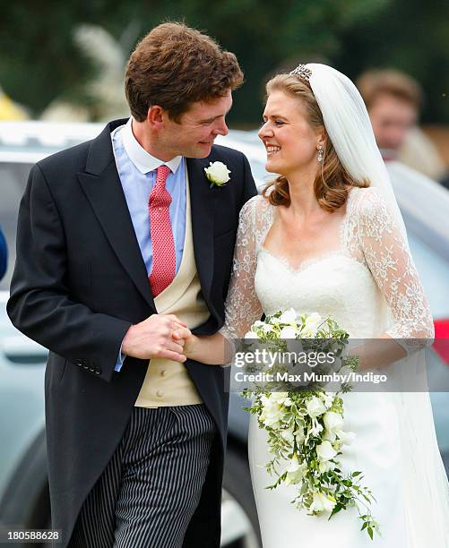 James Meade and Lady Laura Marsham leave the Parish Church of St. Nicholas in Gayton after their wedding on September 14, 2013 near King's Lynn,...