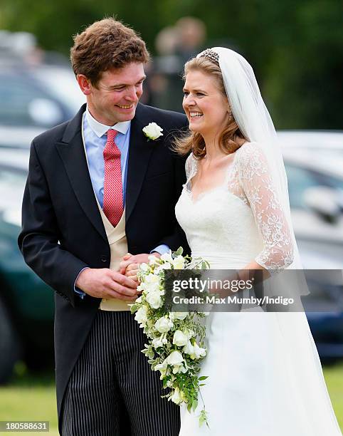 James Meade and Lady Laura Marsham leave the Parish Church of St. Nicholas in Gayton after their wedding on September 14, 2013 near King's Lynn,...