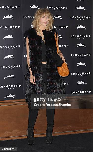 Suki Waterhouse attends the grand opening party of Longchamp Regent Street at Longchamp on September 14, 2013 in London, England.