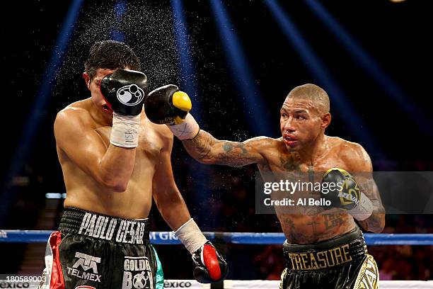 Ashley Theophane throws a right at Pablo Cesar Cano during their welterweight fight at the MGM Grand Garden Arena on September 14, 2013 in Las Vegas,...