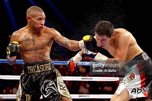 Ashley Theophane throws a left at Pablo Cesar Cano during their welterweight fight at the MGM Grand Garden Arena on September 14, 2013 in Las Vegas,...