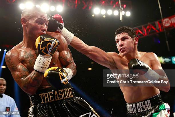 Pablo Cesar Cano throws a right to the head of Ashley Theophane during their welterweight fight at the MGM Grand Garden Arena on September 14, 2013...